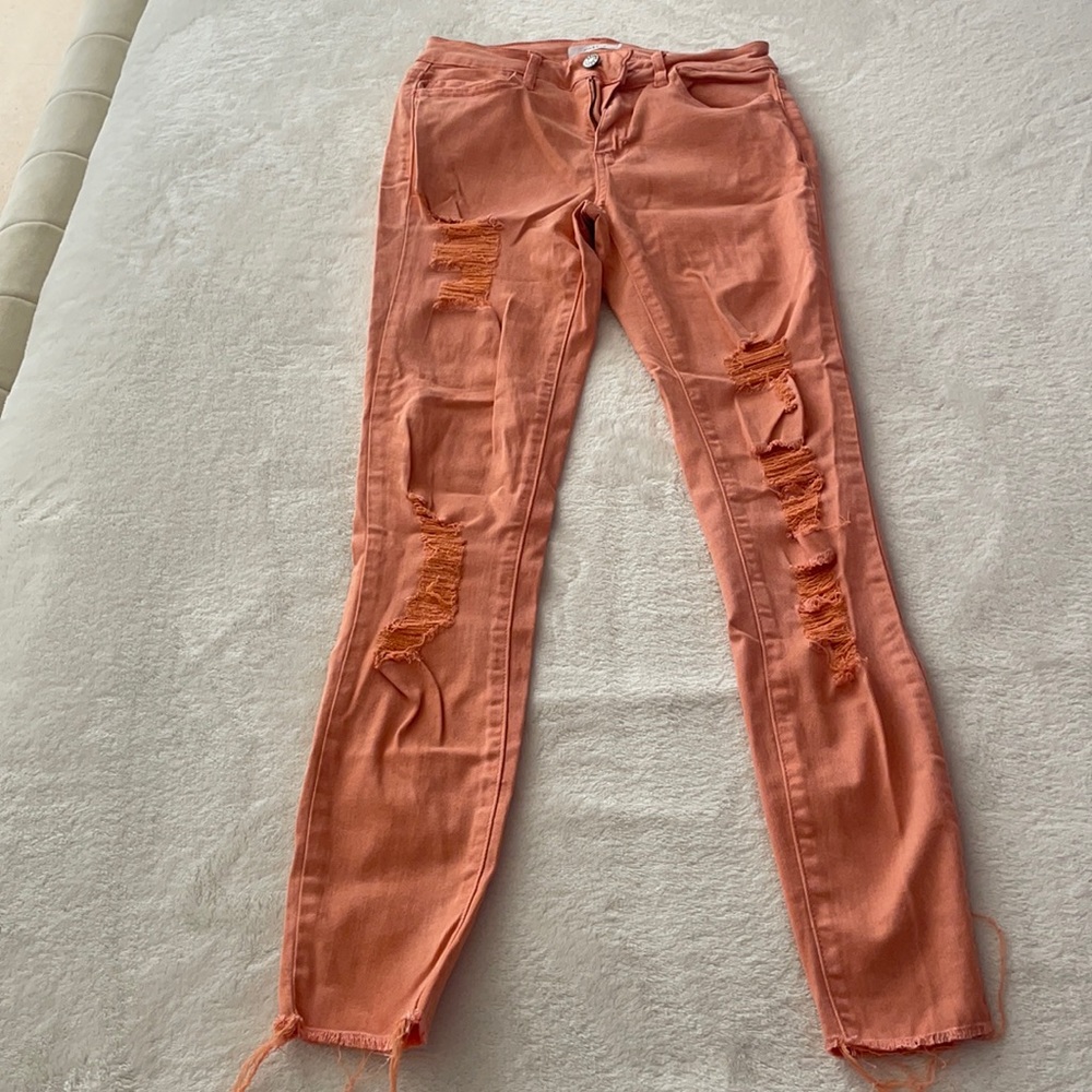 Peach/pink ripped jeans